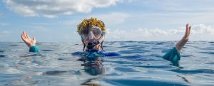 Allison Stillman in the ocean with seaweed on her head